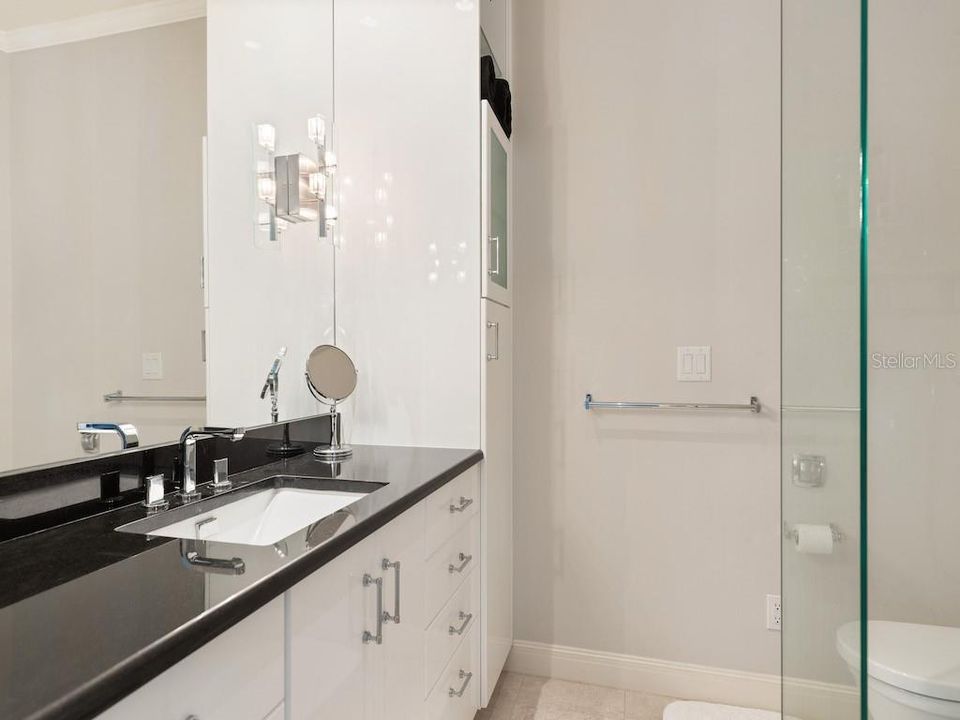 Laundry room off kitchen features custom cabinetry