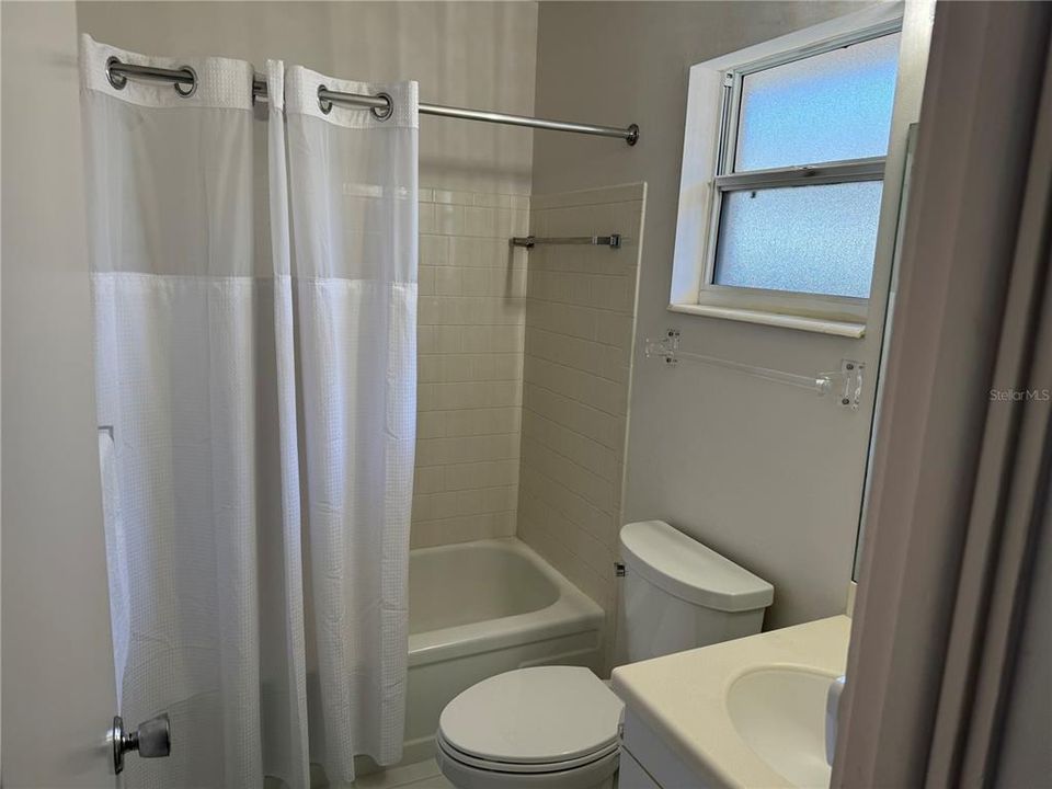 Guest Bath has tub with shower