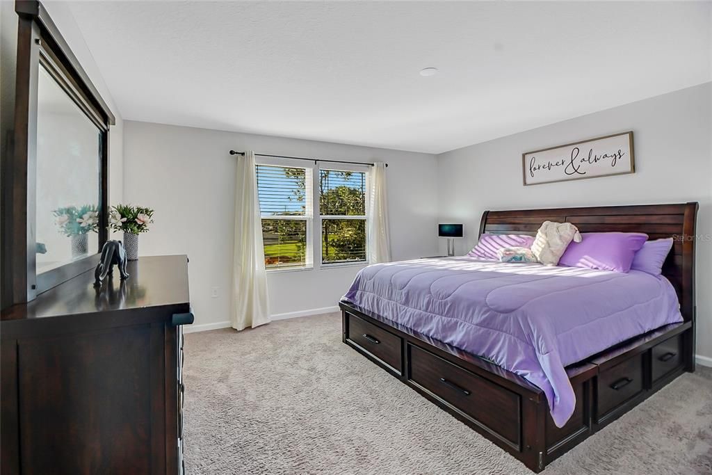 The 15X15 Primary/Master bedroom offers natural light, easily fits a King Size Bed plus nightstands and dressers!