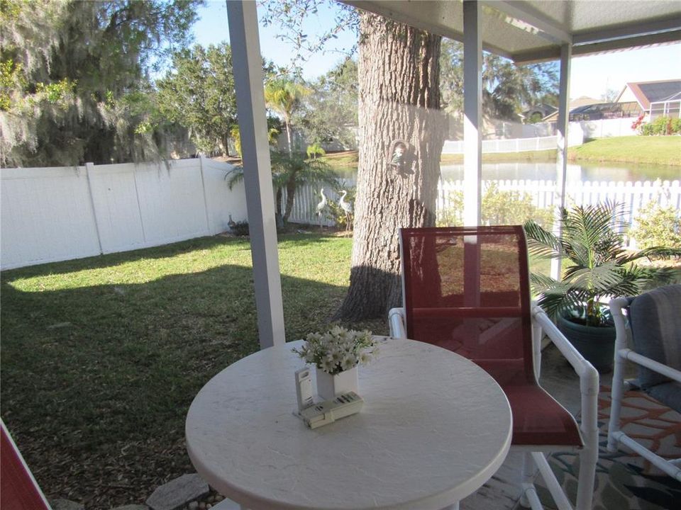 View of backyard from screened in back porch where you will sip on your morning coffee or tea
