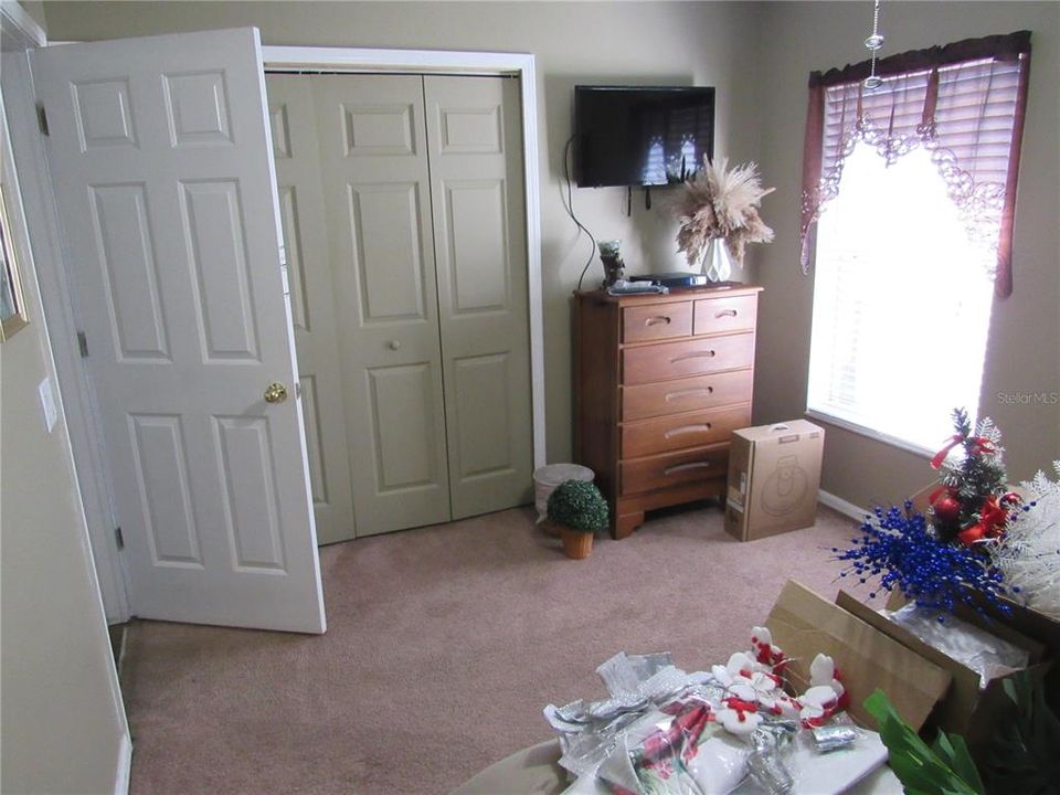 Second Bedroom entry door with large closet in background