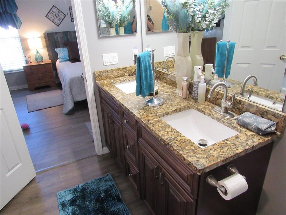 Dual Sinks in Primary Bathroom with granite counter top