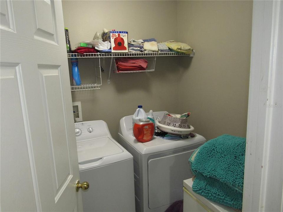 Inside air-conditioned laundry room for washer and drlyer