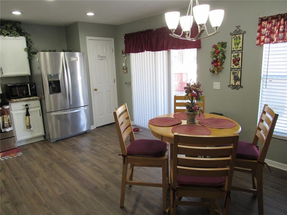 Eat in Kitchen and doors to back porch by pond View 2