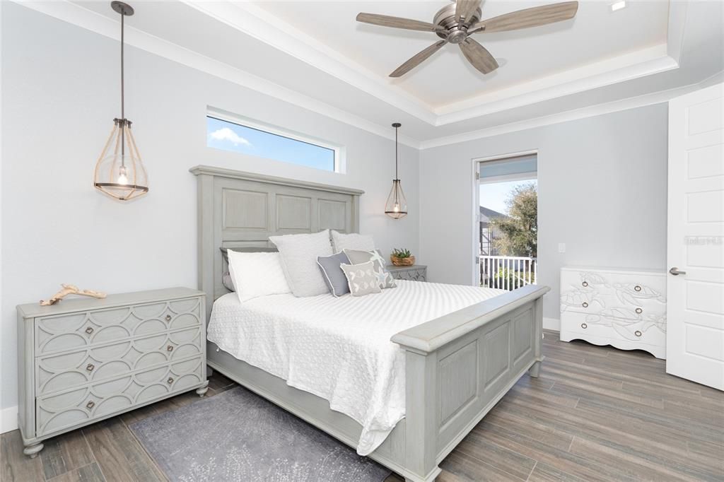 Master Suite leads out to the balcony overlooking pool & canal