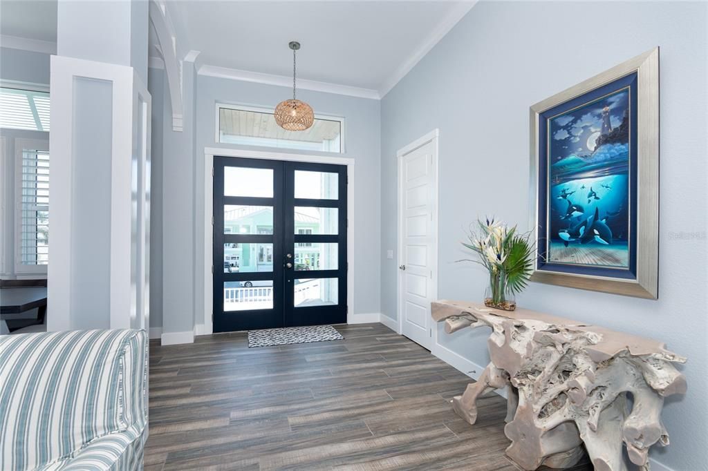 Living Room is accented with a coffered ceiling with accent lighting