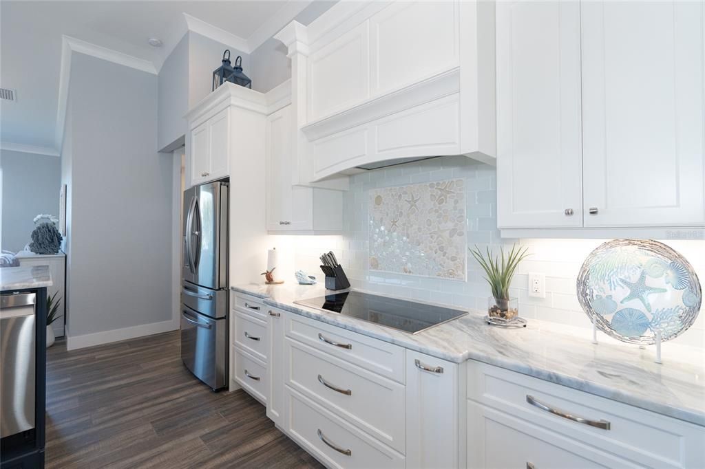 Decorative tiled backsplash & coastal accent inlay