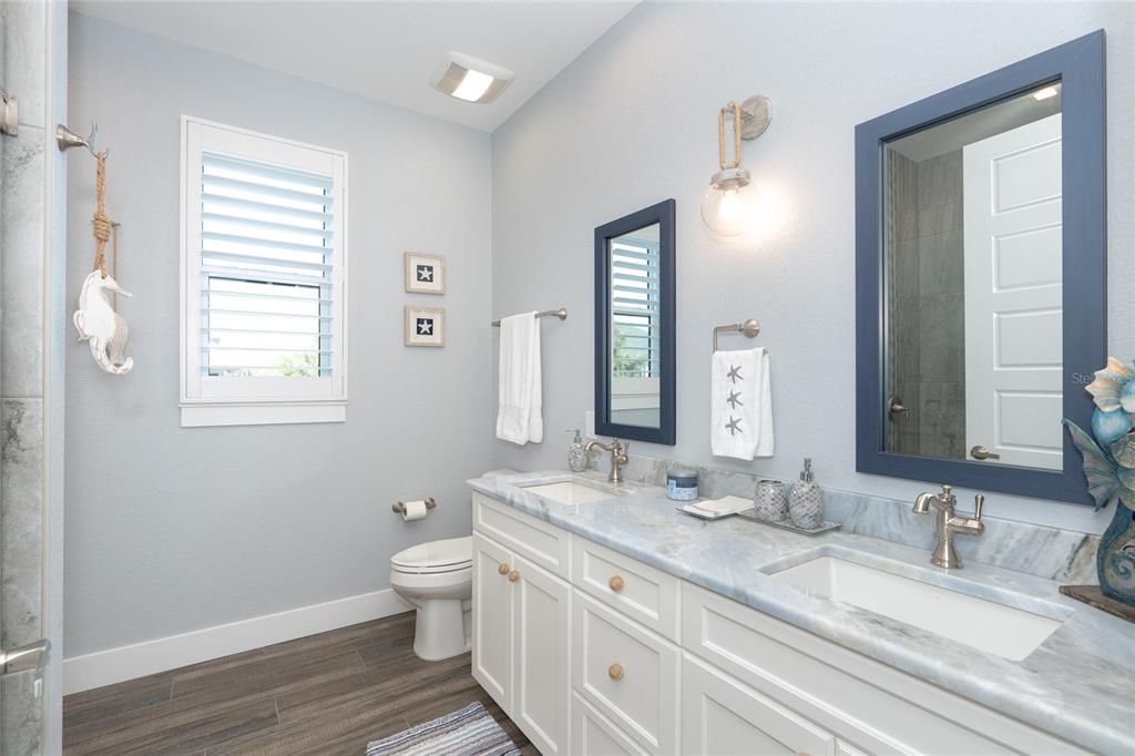 Bath #2 has dual sinks with stunning granite