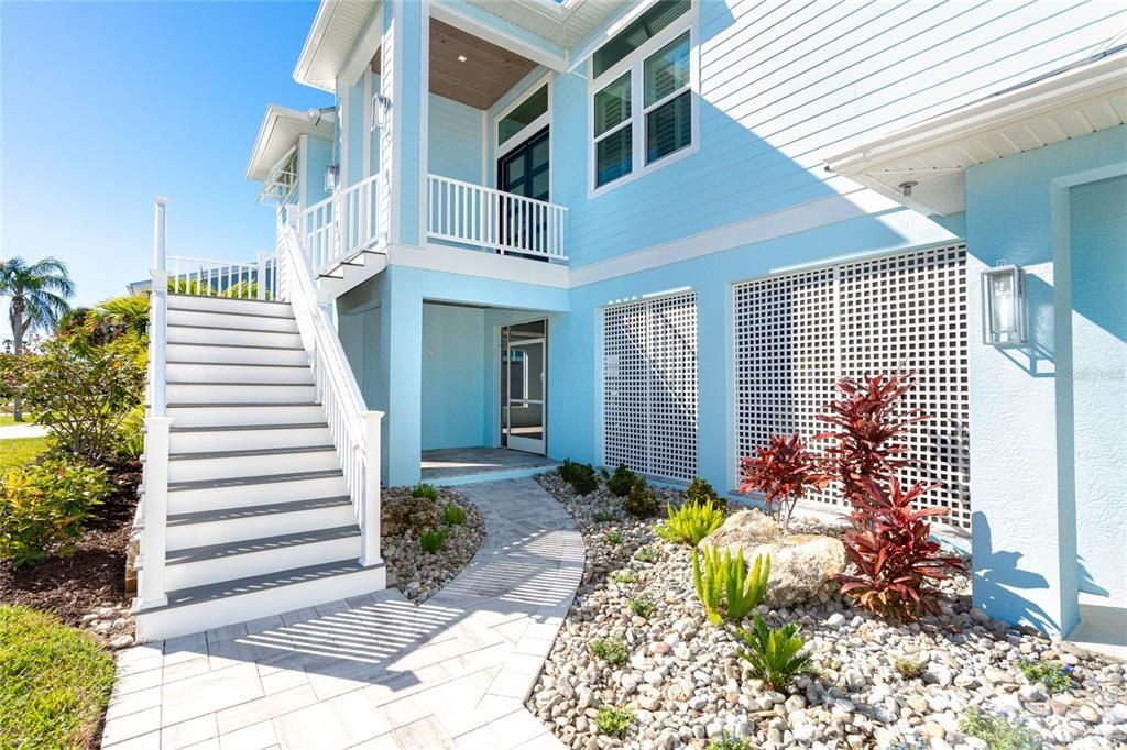 Foyer entrance greets you with stunning plank tile flooring that flows throughout entire home