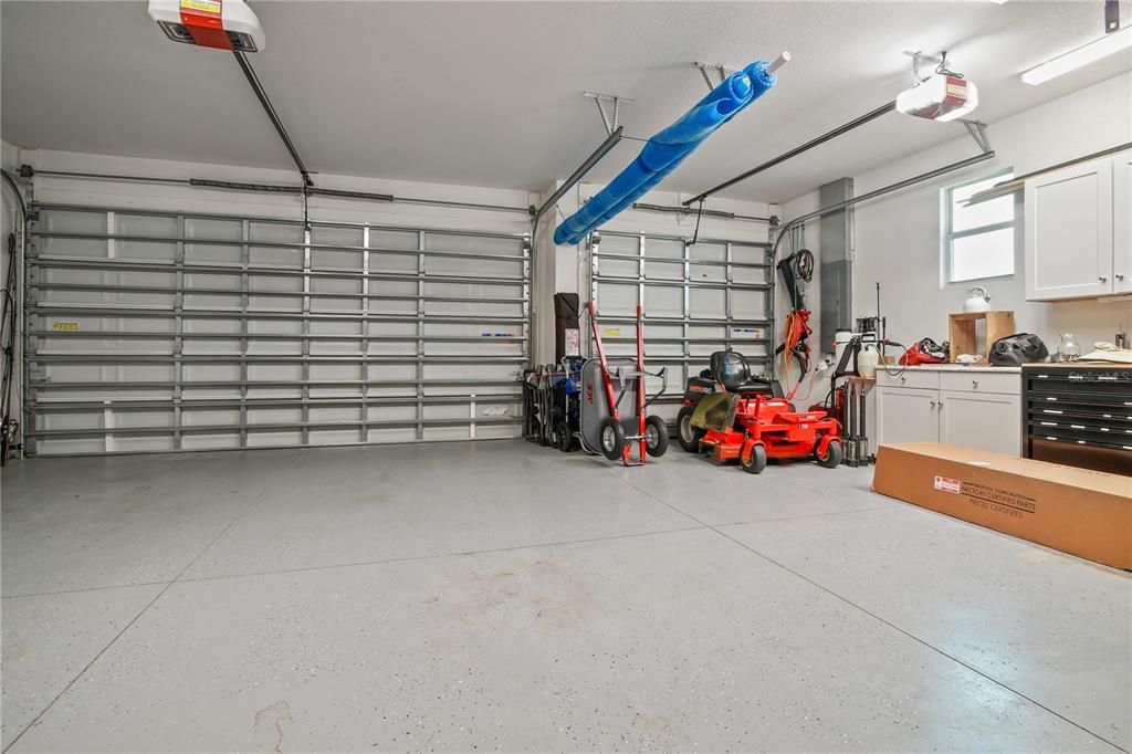 EXTRA UPGRADES TO GARAGE INCLUDE ADDITIONAL LIGHTING, SEALED FLOOR,  BUILT-IN SHELVES AND ATTIC PULL DOWN