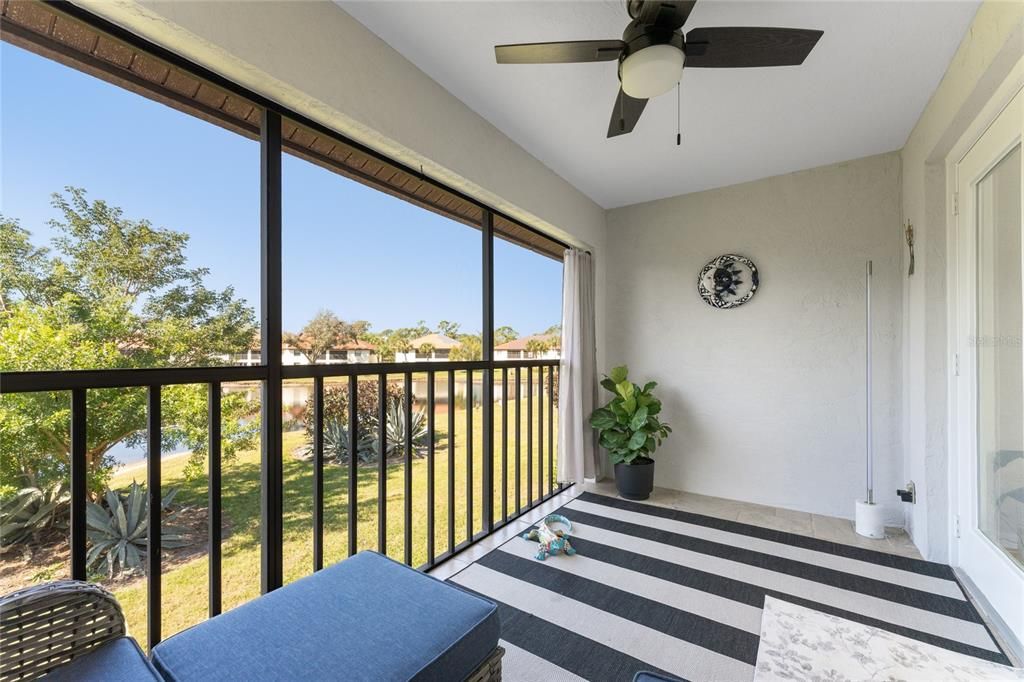 Private lanai with tile flooring and new ceiling fan/light