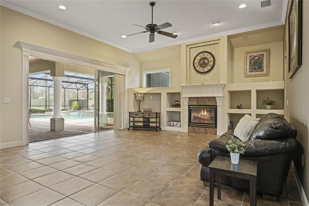Spacious Great Room features Triple Glass Sliding Doors that seamlessly open on to the patio