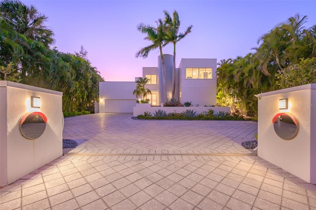 Gated Entry with oversized Driveway with pavers