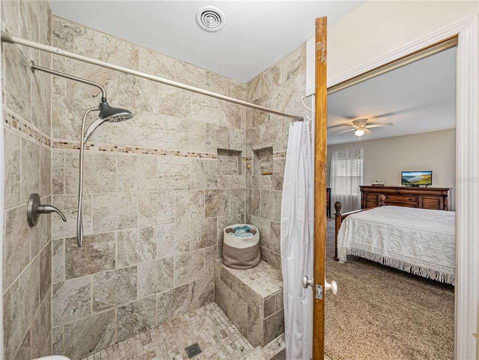 Beautiful new walk-in shower with bench.