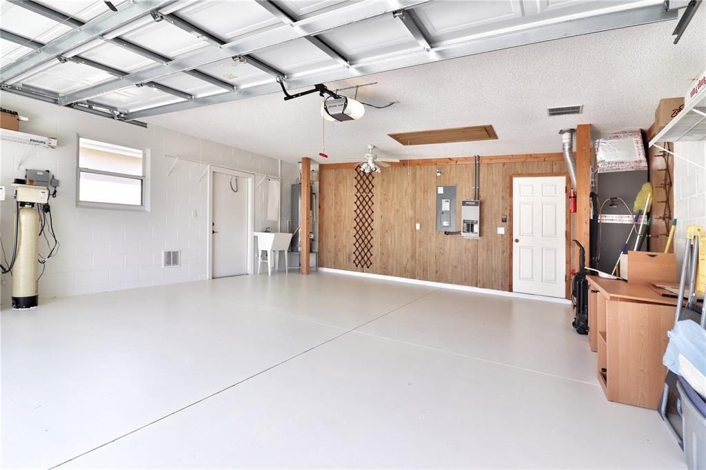 2-car garage with side service door and utility sink