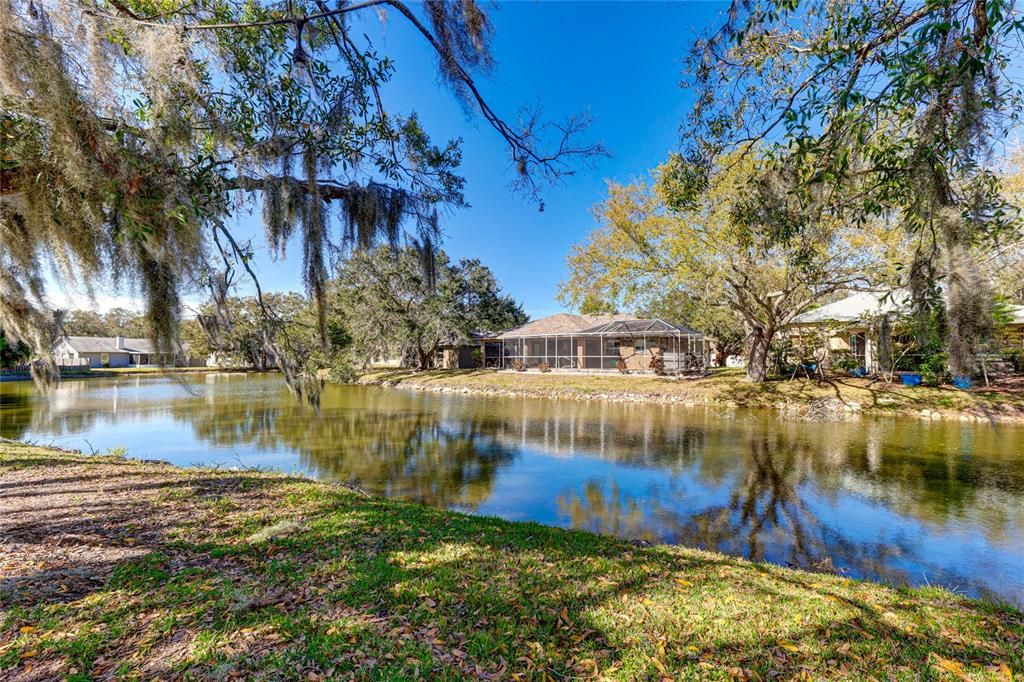 Beautiful, tranquil water view with lush landscaping for shade.