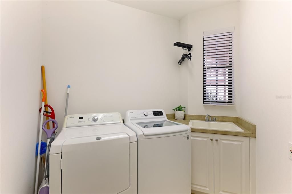 Full Mud Room with utility/linen closet leading to the 2 car Garage.