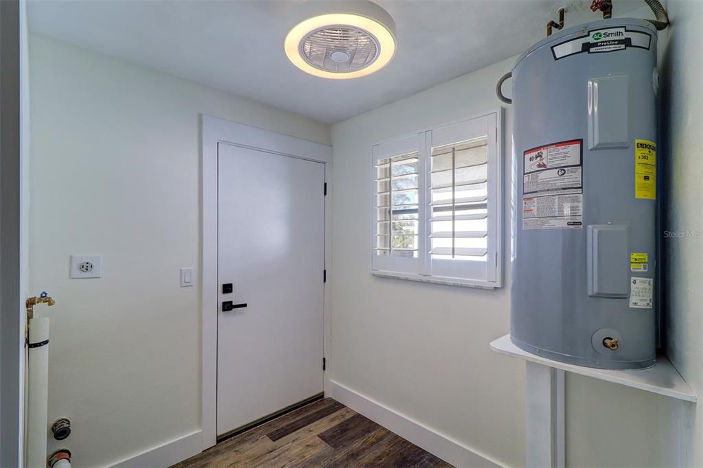 Utility/laundry room accommodates a full size stackable washer and dryer/Back door access to hallway and  stairs to backyard (Unit 2)