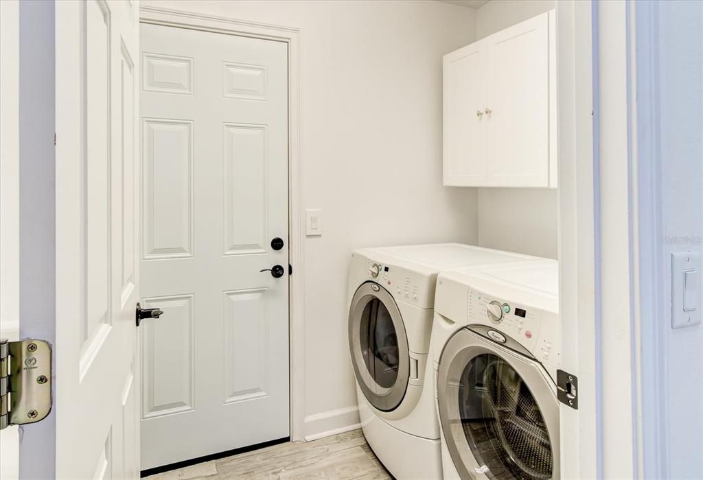 Laundry room with door to 3 car garage