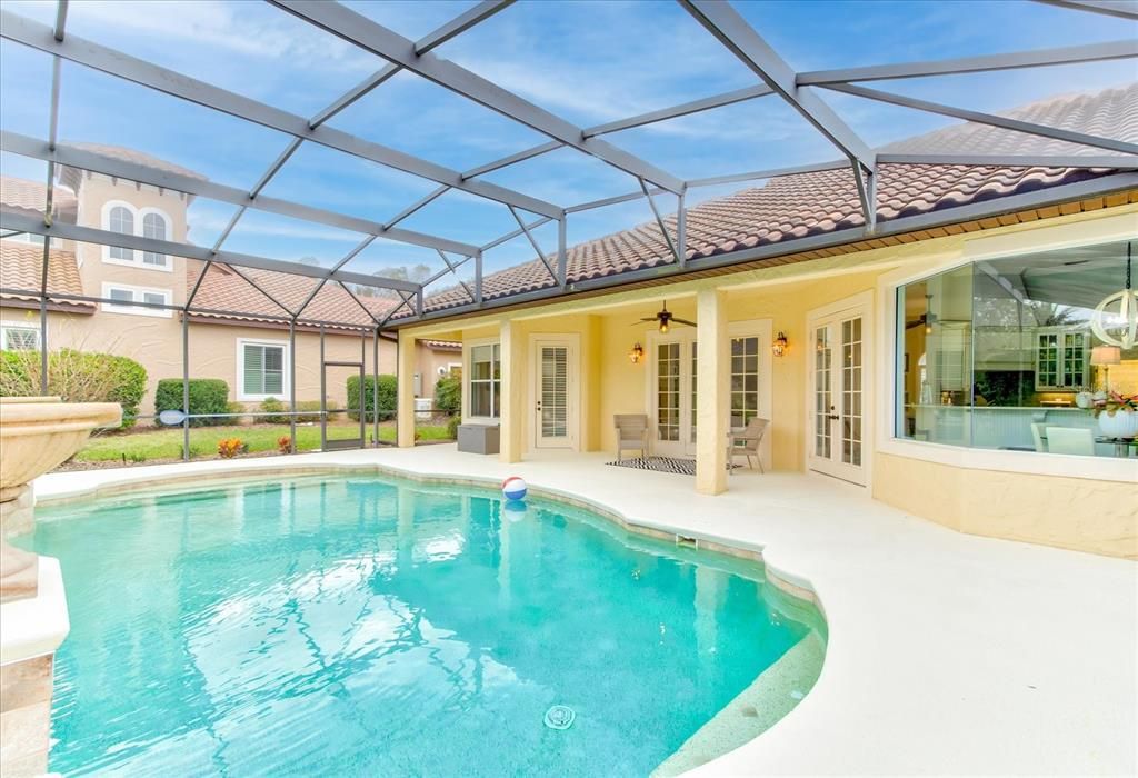 Totally screened covered pool with covered patio.