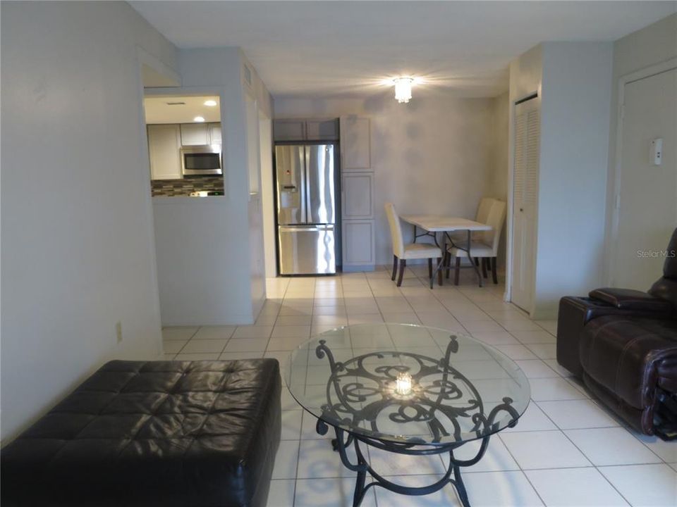 All tiled Living Room to Kitchen