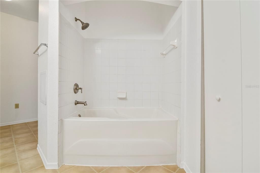 Full sized soaker tub with shower that's clean as a whistle!