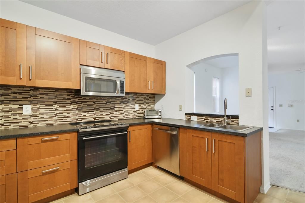 Beautifully appointed IKEA kitchen with newer cabinets, countertops, appliances and more.