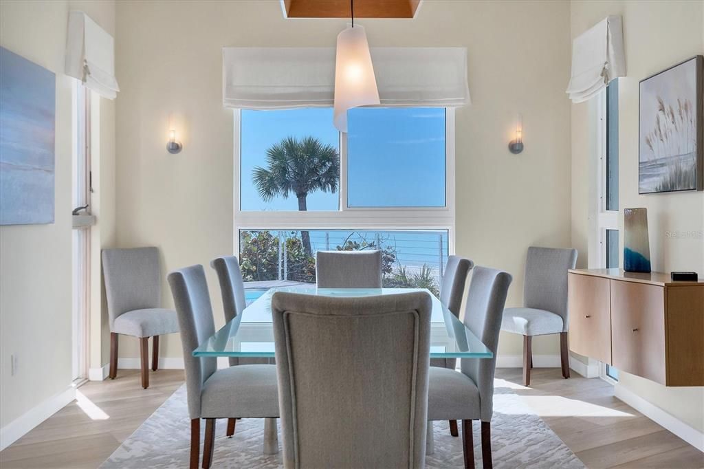 Dining room over looks pool with ocean views.