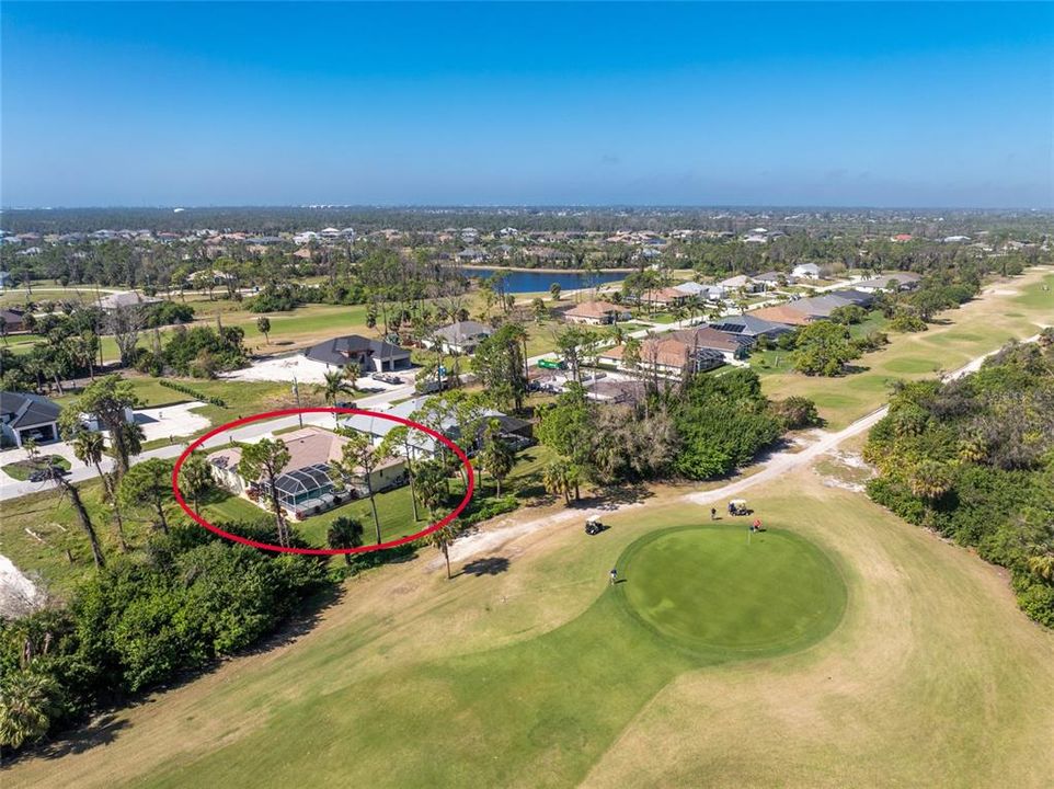 Aerial from the golf course behind the home.