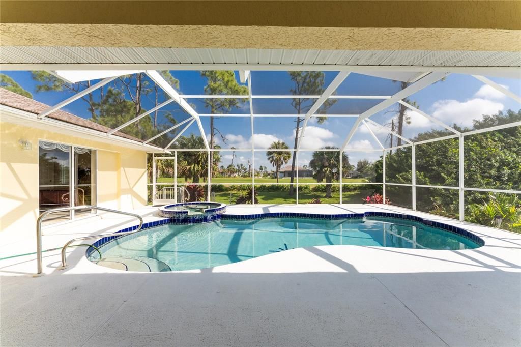 This roomy pool features a built in spa with waterfall feature, and a swimout.