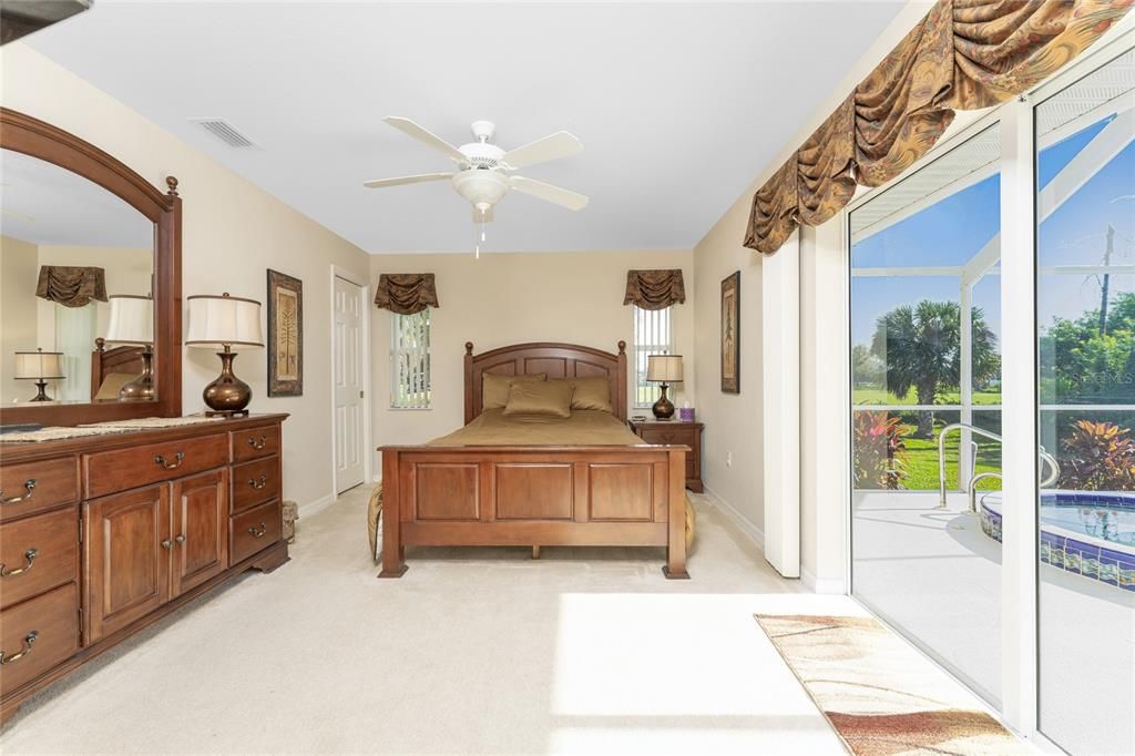 The second master bedroom (Bedroom #4)  features carpeted flooring, a ceiling fan and a walk in closet.