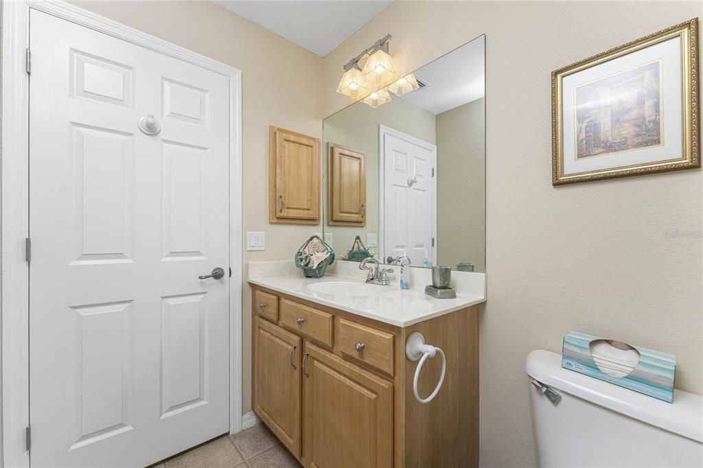 The guest bathroom has a good sized vanity with cultured marble top, and a built in medicine cabinet.