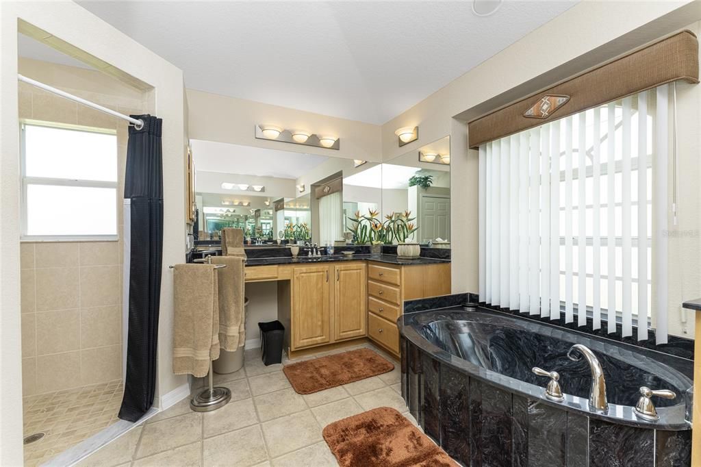 The master bathroom also has a separate, tiled walk in shower.