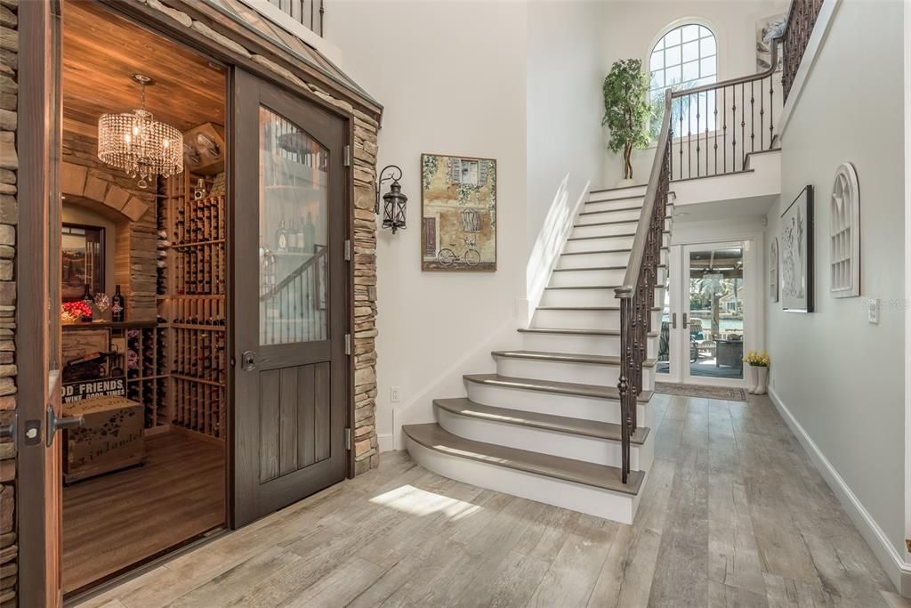 Grand Staircase with entry to Wine Cellar