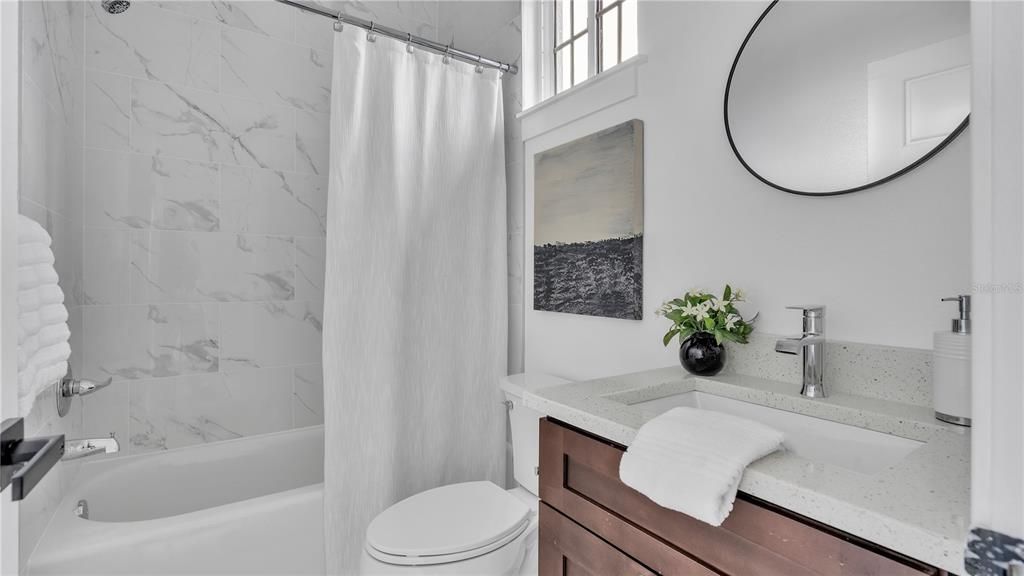 Second Bathroom with quartz countertop- bathtub and shower