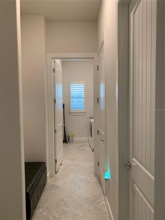 Mud room and hallway with 1/2 bath and to laundry room from garage