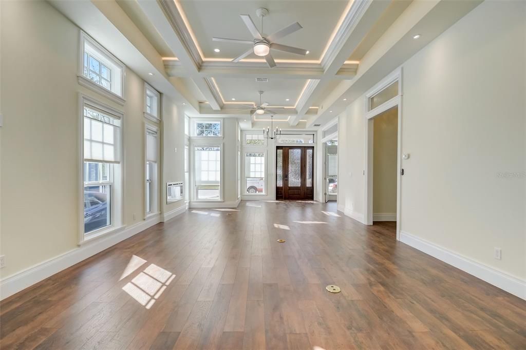 View of open Dining, Living & Setting Areas and Gorgeous Ceilings with Beautiful Woodwork & Inset Lighting!!!