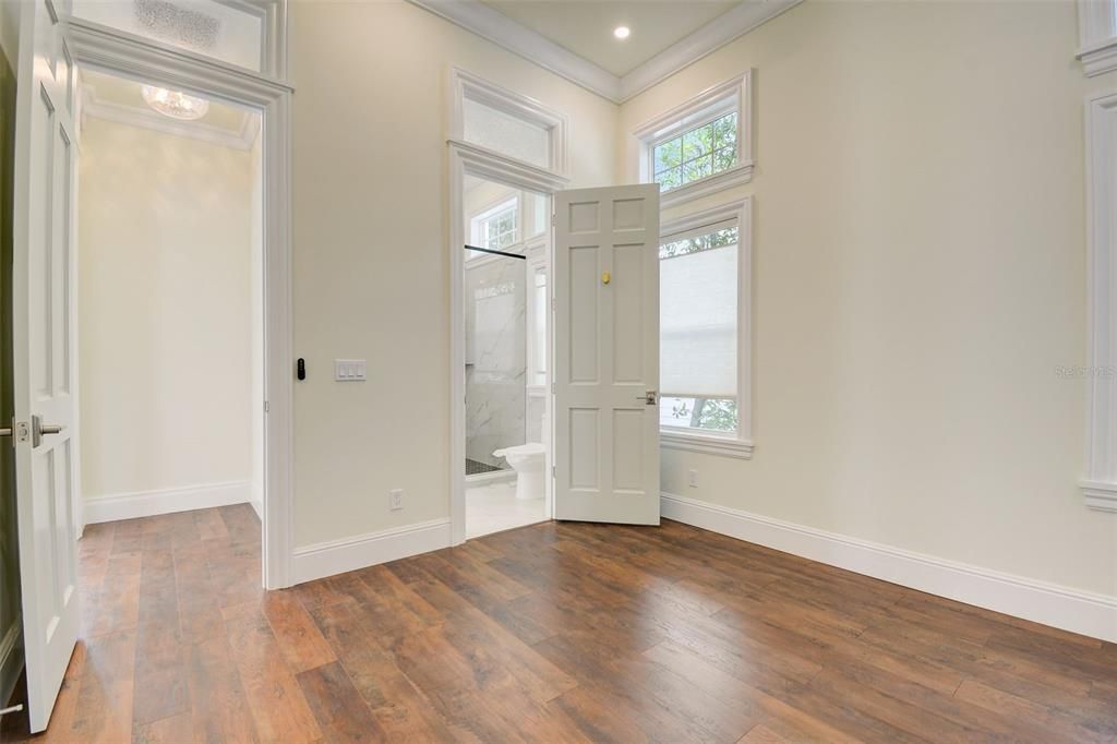 2nd Bedroom showing view into hallway and doorway into bathroom