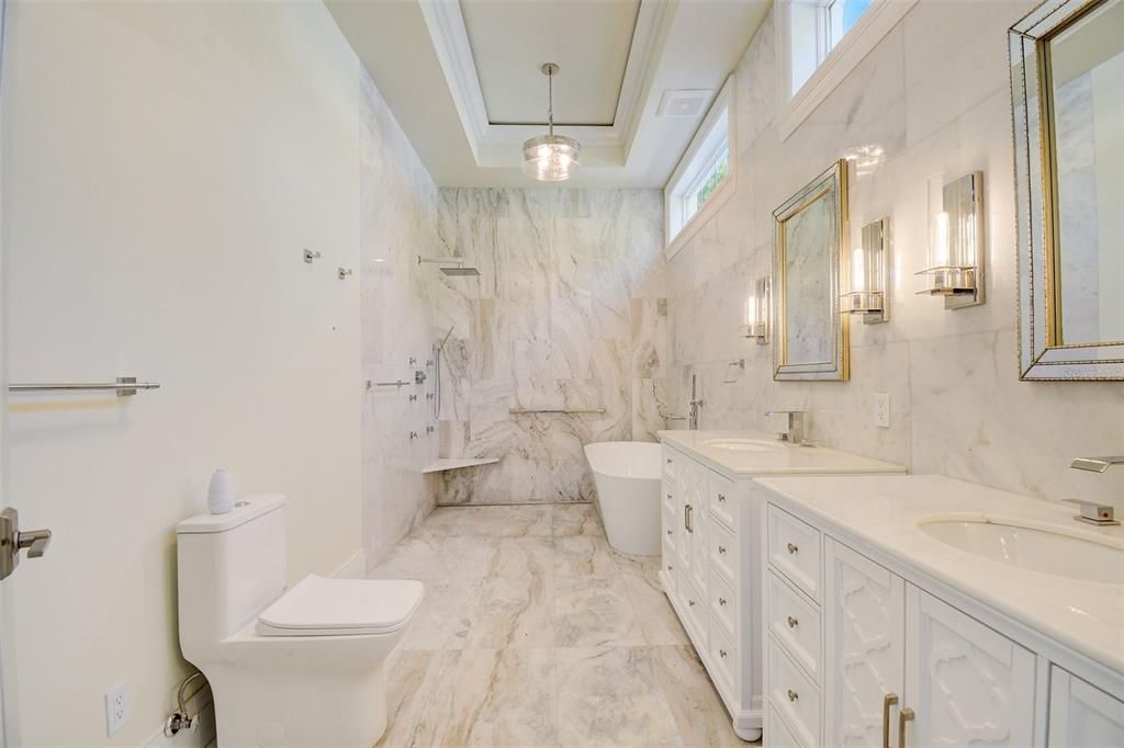 Luxurious Master En Suite with gorgeous marble flooring, double vanities & large open shower with soaking tub!