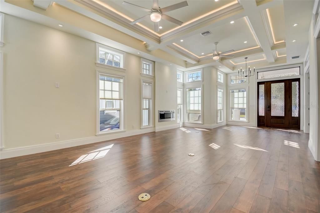 View of Living Room, Front Sitting Area & Grand Entry Door!! Gorgeous woodwork and large windows letting in lots of sunlight all through home!!!
