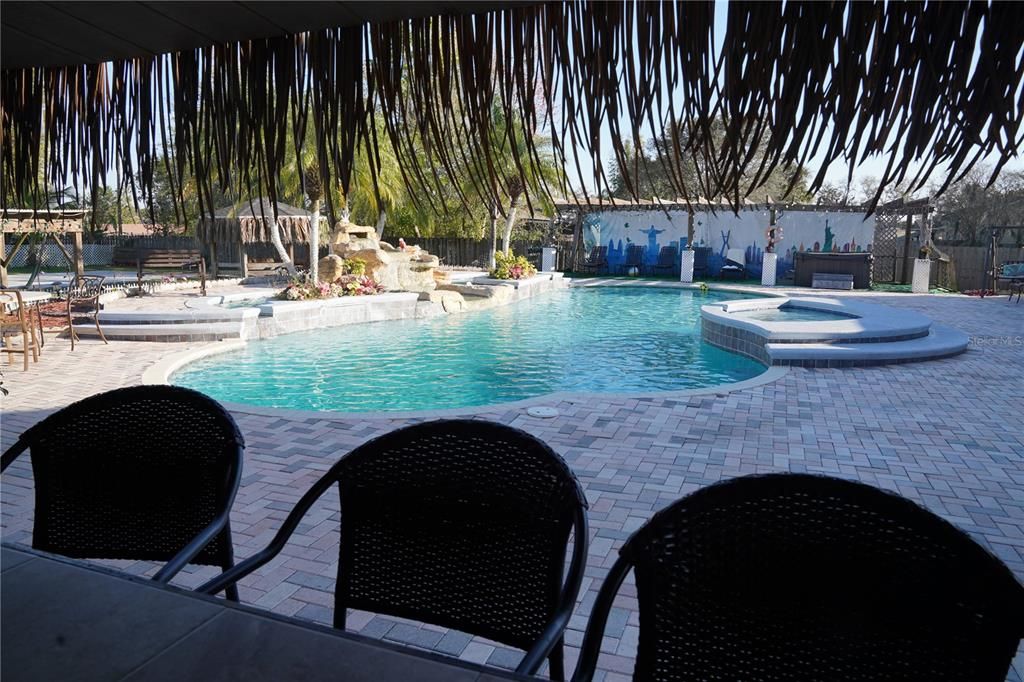 looking from inside tiki bar towards the pool