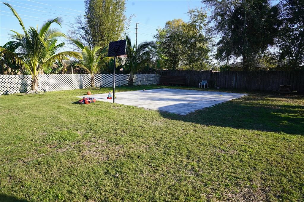 back yard with basketball court