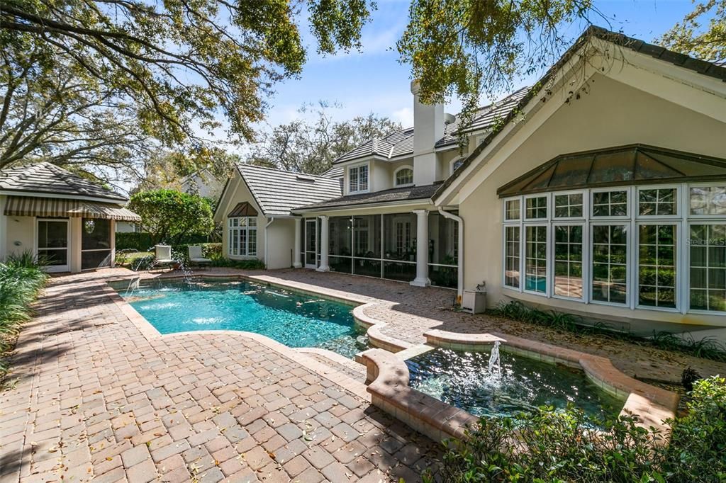 A tranquil pool with fountains and a spa provide the ideal place to relax.