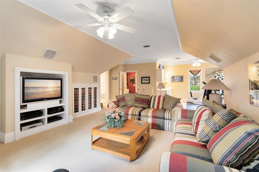 The bonus/exercise room, featuring a wet bar, enhances the home's appeal as a haven for relaxation and leisure.