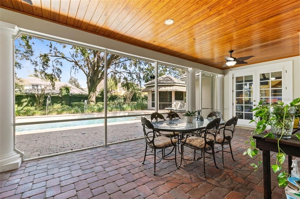 The screened lanai with a beautiful wood ceiling.