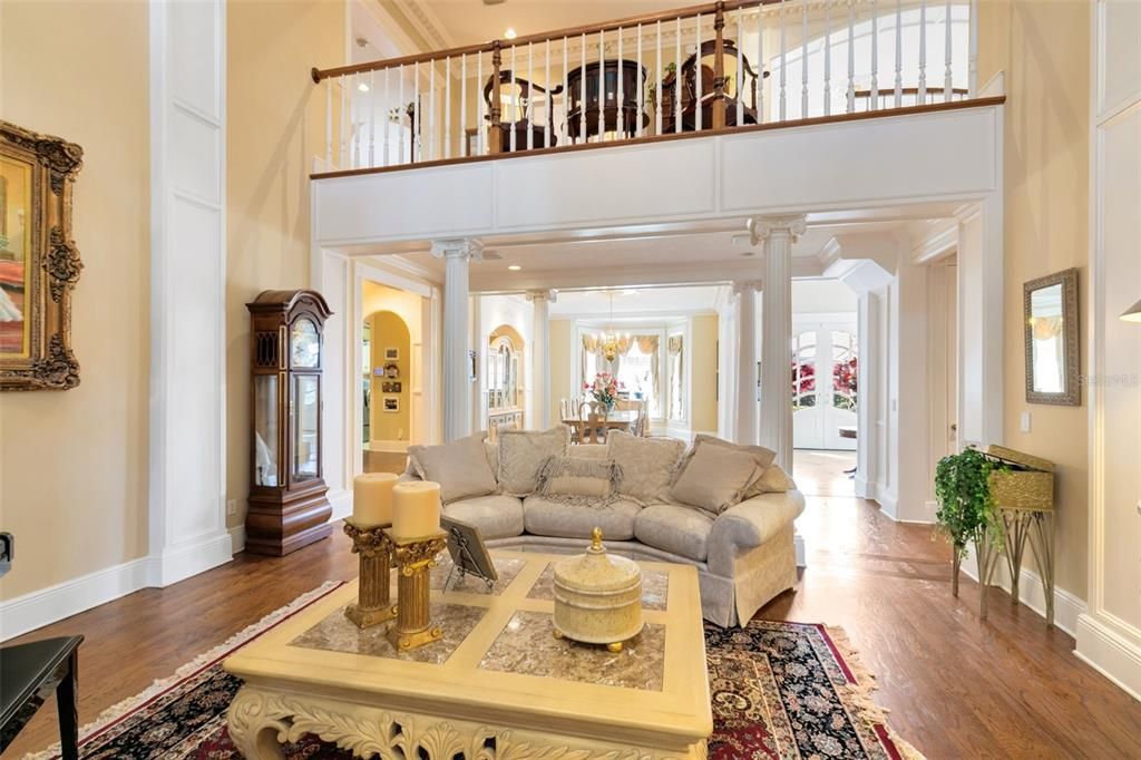 A view from the formal living room back to the formal dining area and entry.