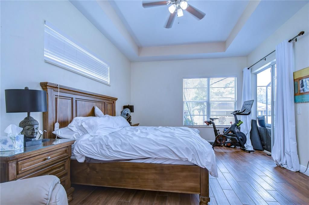 Updated floors, a tray ceiling, & private access to the lanai!