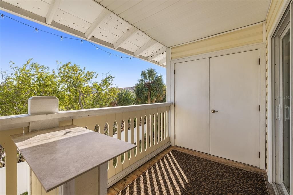 Washer and Dryer in closet on porch