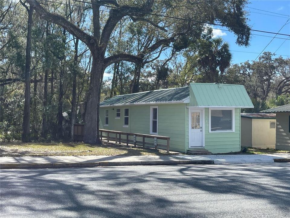 Curb side view of the property including parking lot.