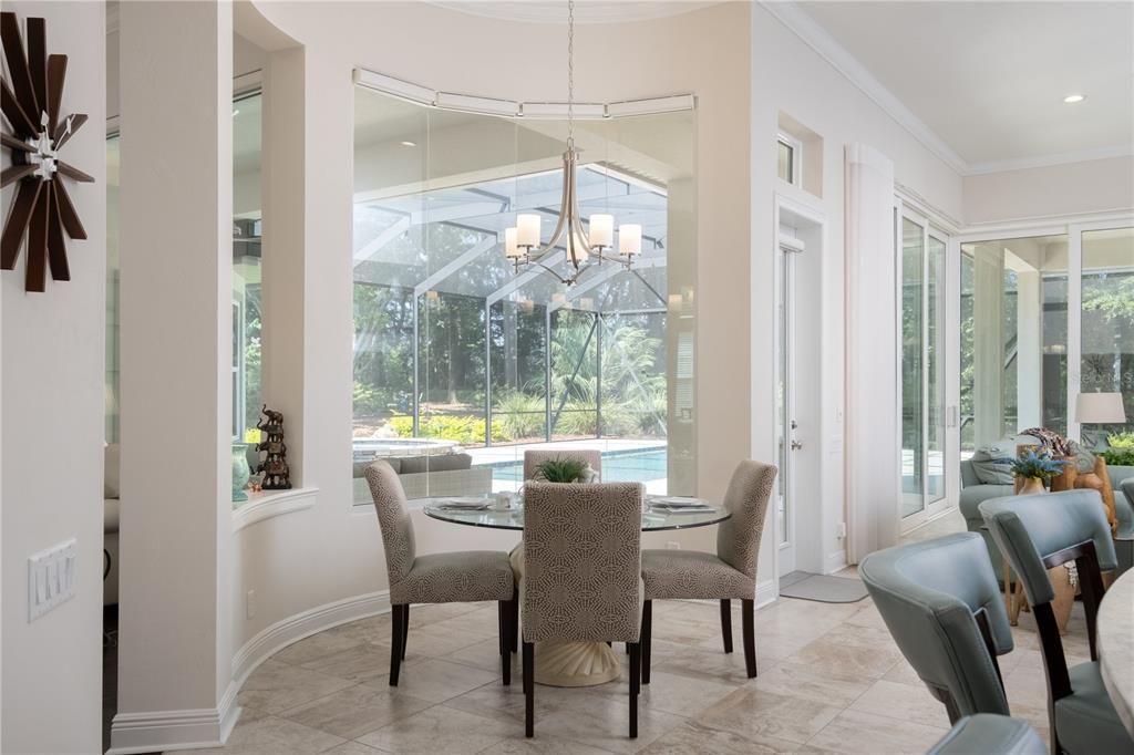 Breakfast Nook with stunning seamless glass curved windows